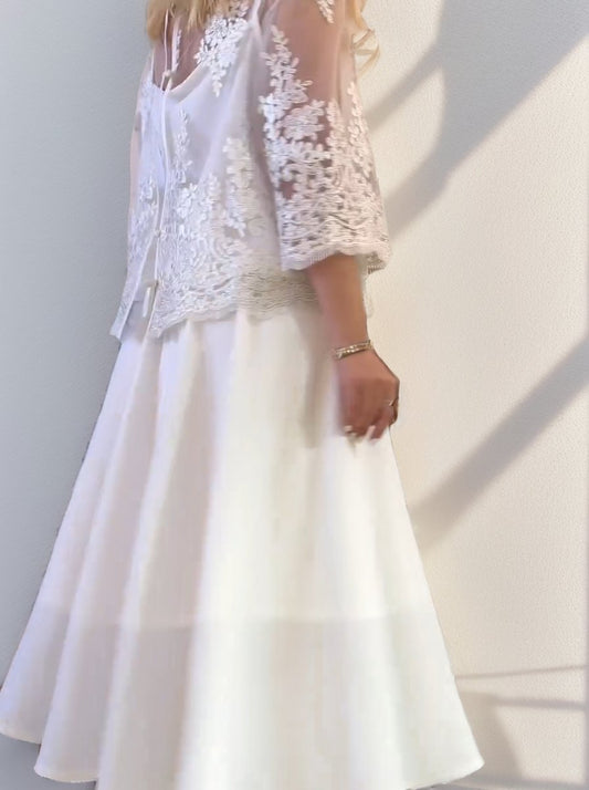 Spun lace embroidered blouse paired with white dress